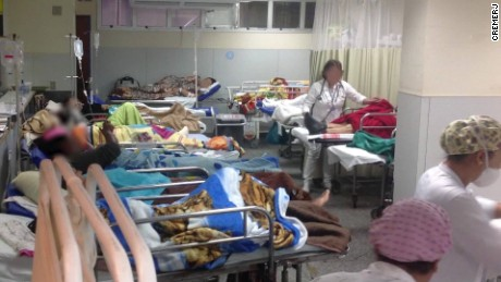 Hospital in Rio de Janeiro, Brazil, with faces blurred and beds crowded