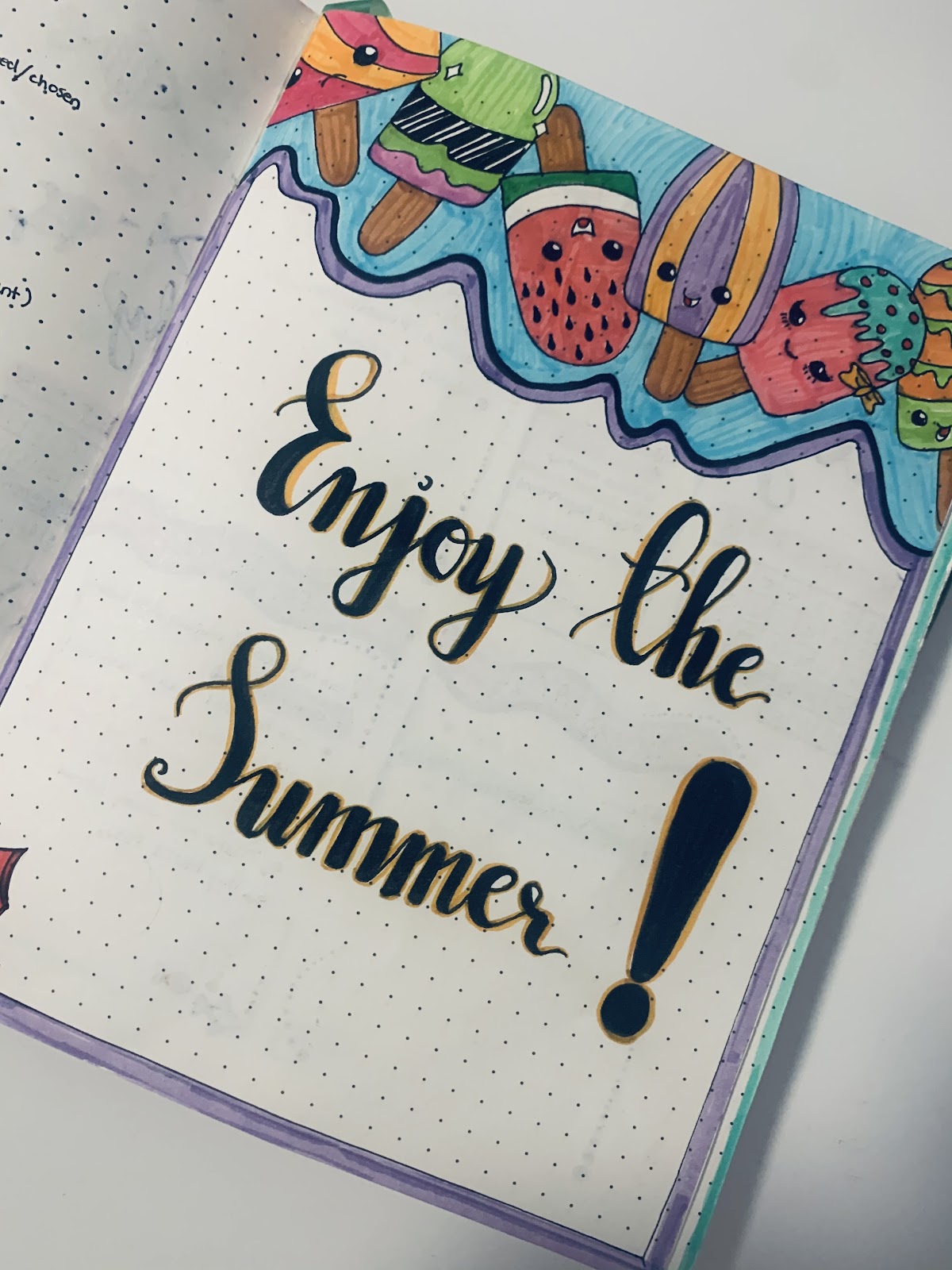 Quote written in journal that says Enjoy the Summer!